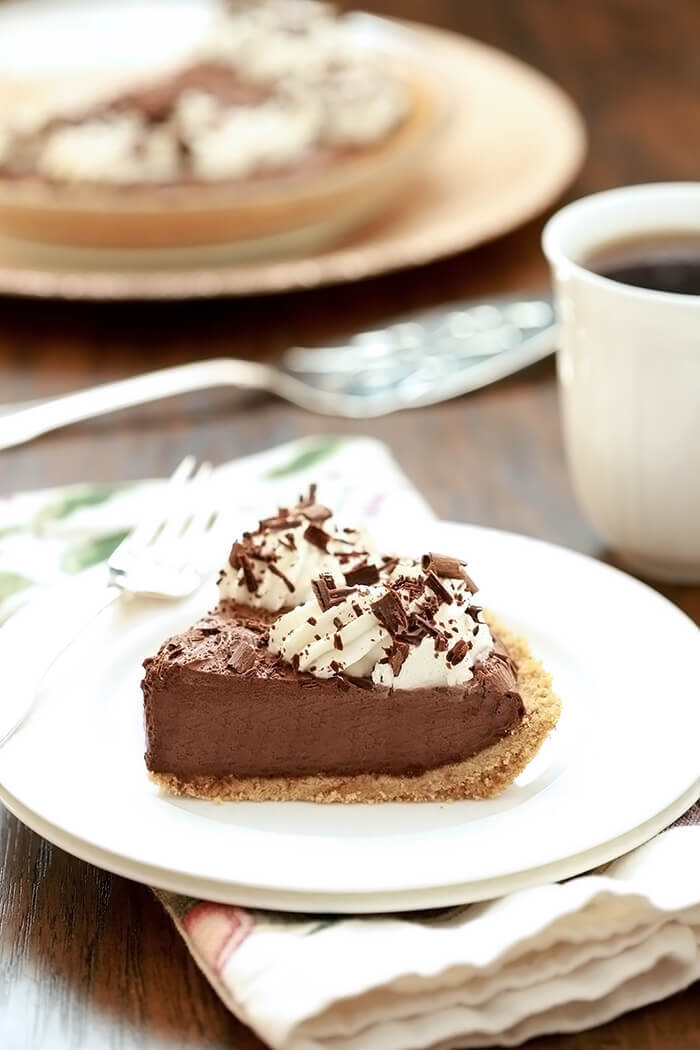 A slice of French Silk Pie with Bourbon on a white plate.