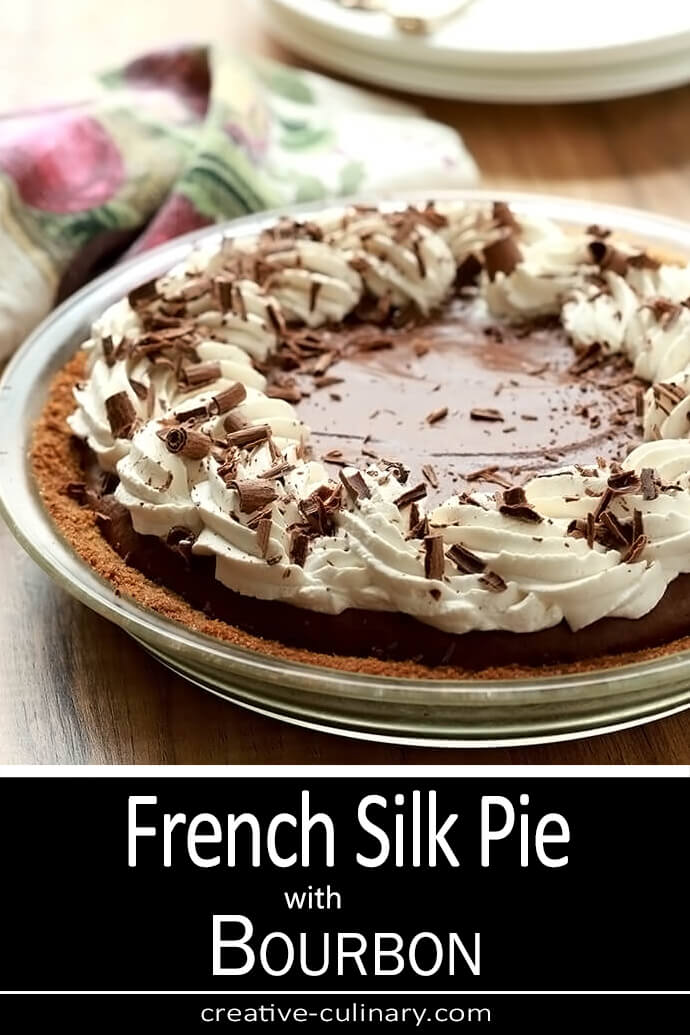 French Silk Pie with Bourbon PIN image showing the whole pie with whipped cream and chocolate curls.