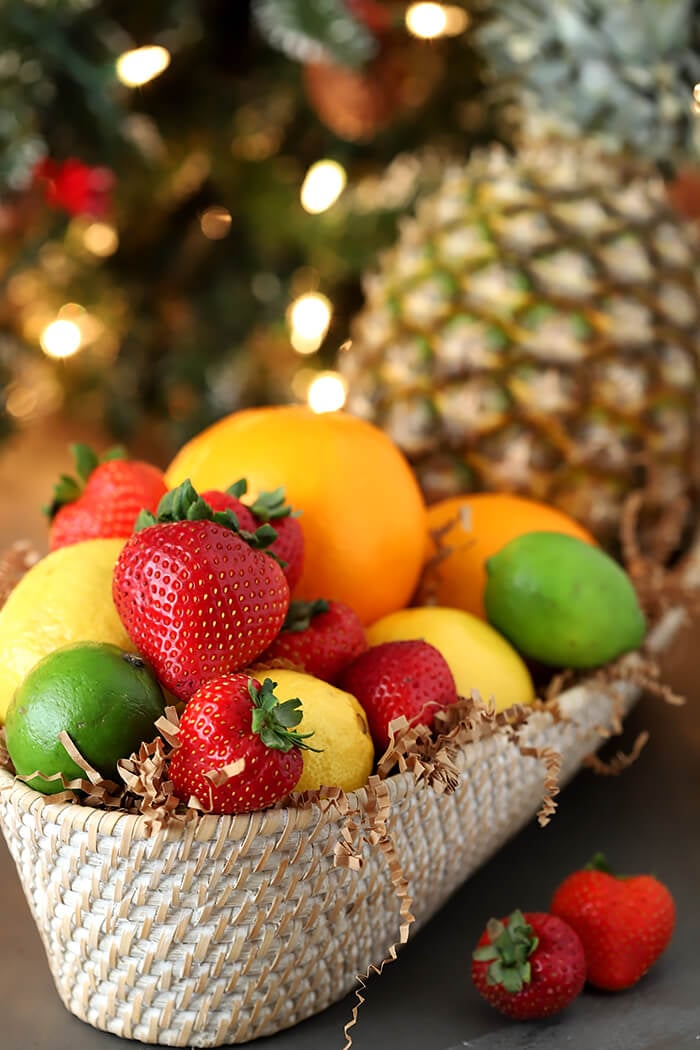 Basket of Fresh Fruits for Punch including Pineapple, Oranges, Lemons, Limes, and Strawberries