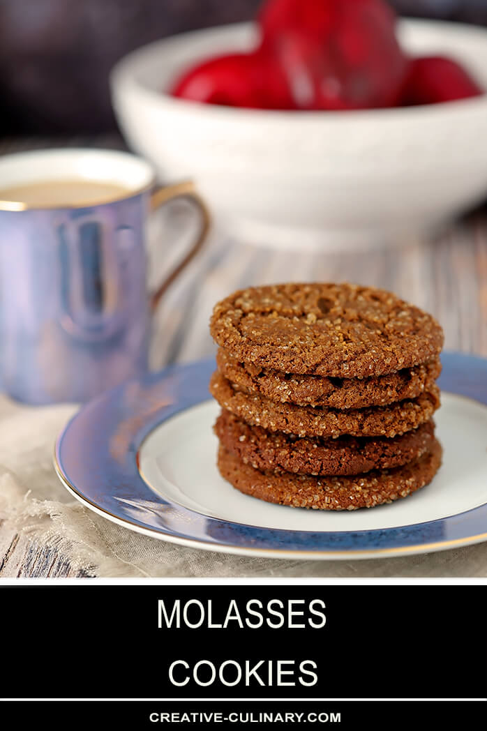 Molasses Cookies on a Blue and White Plate with Apples in the Background