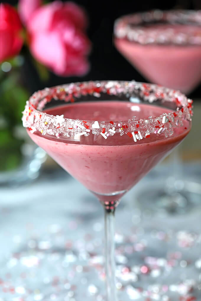 Raspberry and Chocolate Valentine Cocktail in a Martini Glass with Clear, White and Red Sugars on Rim