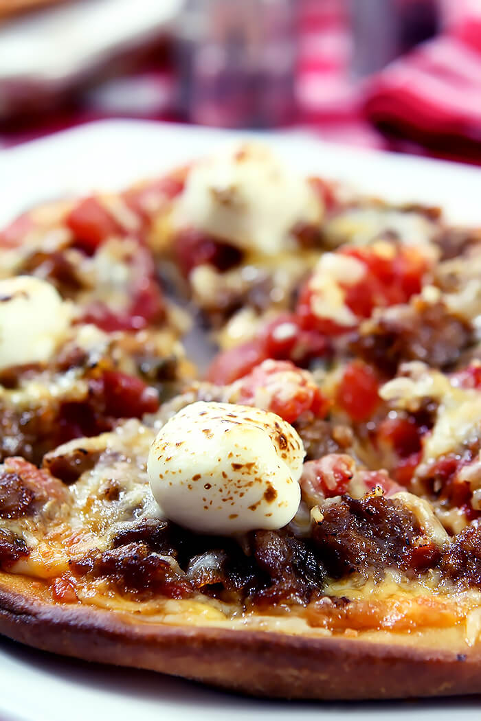 Pillows of Cream Cheese Top Sausage and Hatch Green Chile Pizza on Naan Bread