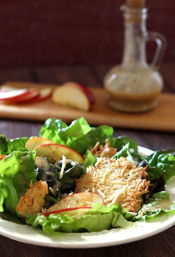 Red Leaf Lettuce and Apple Salad with Parmesan Crisps Red Leaf Lettuce and Apple Salad with Parmesan Crisps on a White Plate