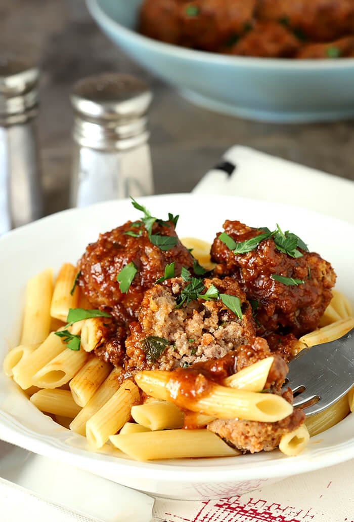 Bowl of Beef, Bourbon, and Bacon Meatballs Served on Penne Pasta