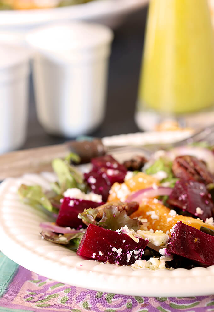 Roasted Beet Salad with Oranges, Pecans & Feta Cheese Roasted Beet Salad with Oranges, Pecans & Feta Cheese on a White Plate