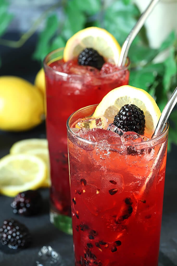 Blackberry Bourbon Collins Cocktails with Lemon and Blackberry Garnish