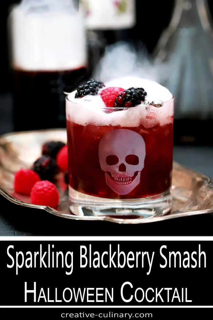 Sparkling Blackberry Smash Cocktail in Highball Glass Garnished with Blackberries and Raspberries
