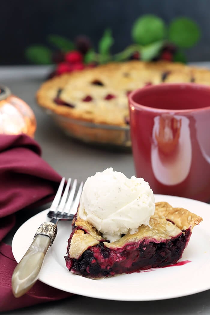 A Slice of Booberry (Mixed Berry Pie) with Vanilla Ice Cream on Top