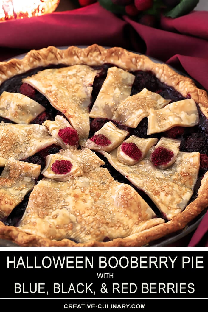 This Halloween Booberry Pie has Mixed Berries and a Design on Top with Pastry That Looks Like Fingers Grasping From Below