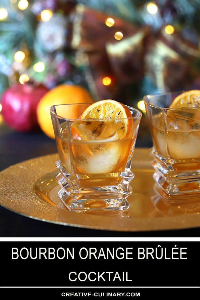 Two Bourbon Orange Brûlée Cocktails on Gold Serving Tray with Orange Garnish