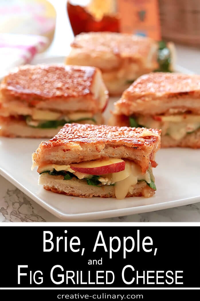 Bried, Apple, and Fig Grilled Cheese Sandwich served on a White Plate