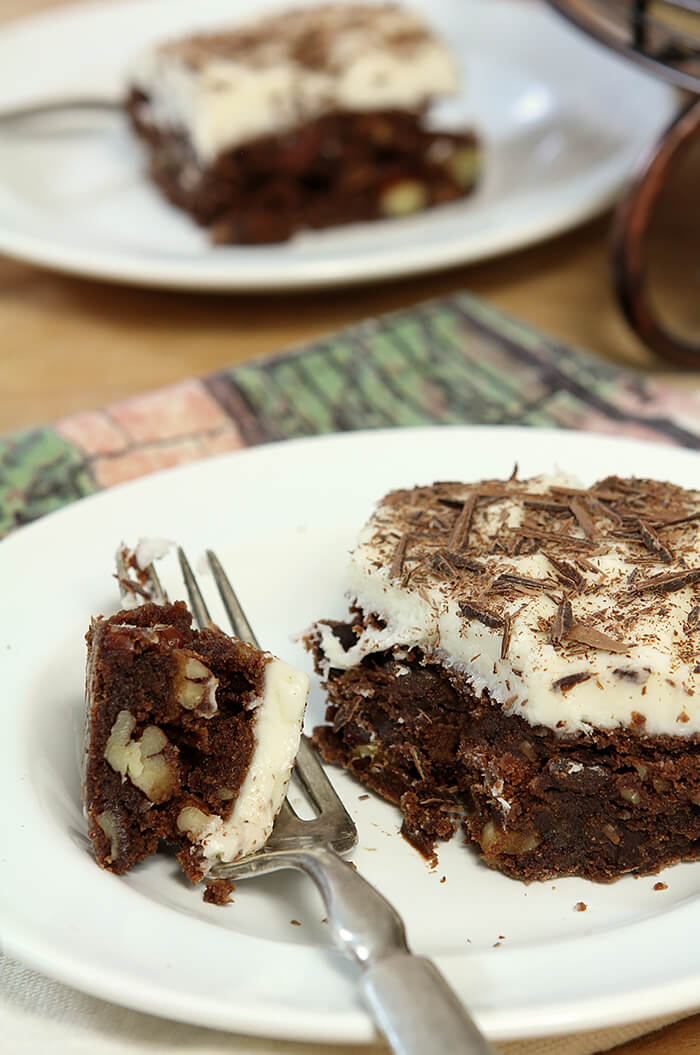 Chocolate Chip Brownies with Cream Cheese Frosting with a Bite on a Fork