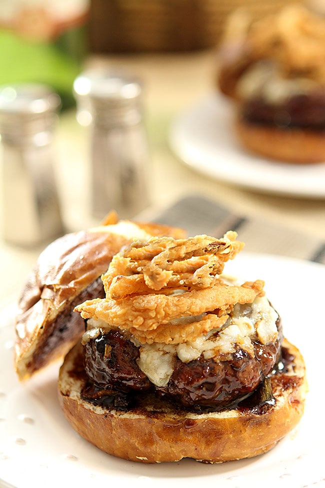 Lamb Burger with Goat Cheese and Onion Rings topped with a Cabernet BBQ Sauce