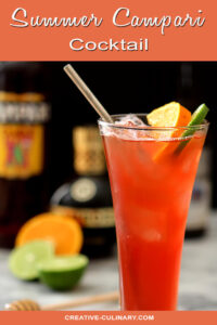 Summer Campari Cocktail in a Tall Glass with a Straw and Garnished with Orange and Lime