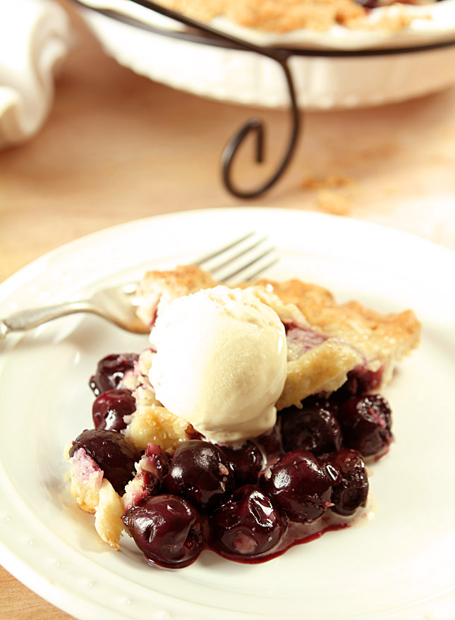 Homemade Cherry Pie Slice on White Plate