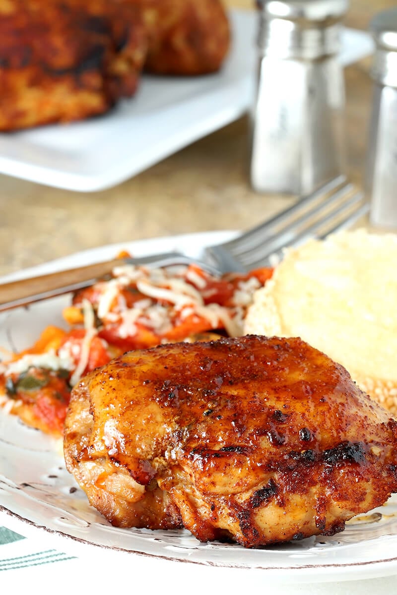 Air Fryer Chicken Thighs with Brown Sugar and Spices Served on a White Plate with Pasta