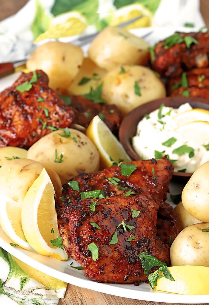 Spanish Tapas Chicken Thighs Served on a Large Platter with Potatoes and Garlic Aioli