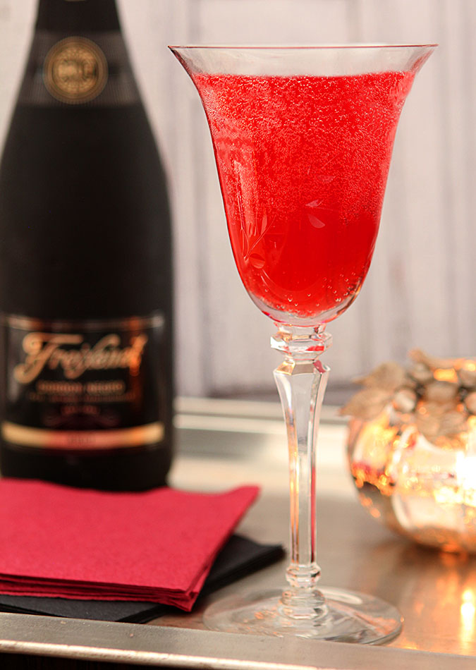 Cranberry Liqueur Champagne Cocktail Cranberry Liqueur Champagne Cocktail in a Wine Glass