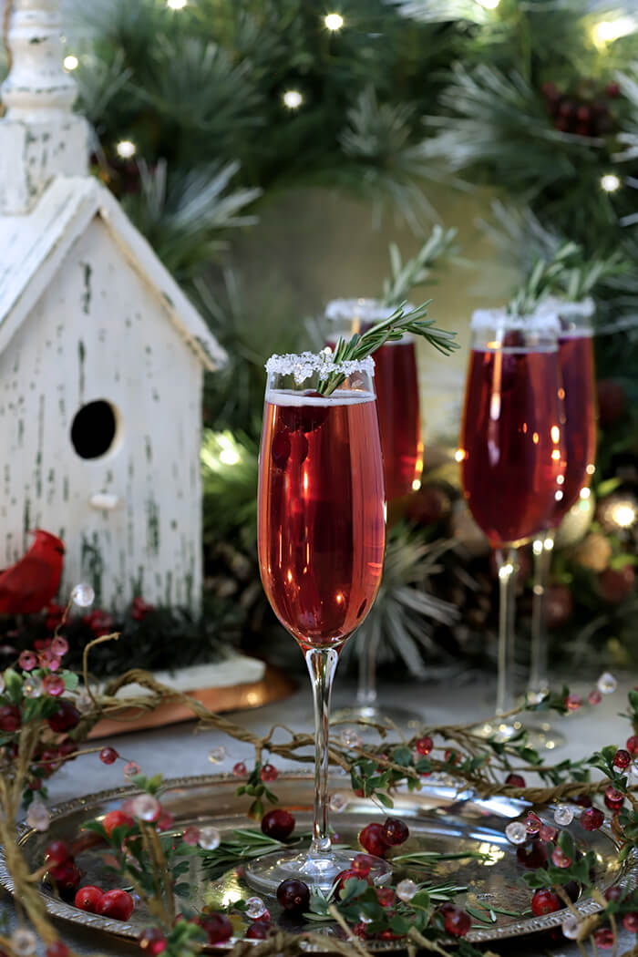 Set of four Tiffany Champagne Goblets with a Cranberry Poinsettia Cocktail
