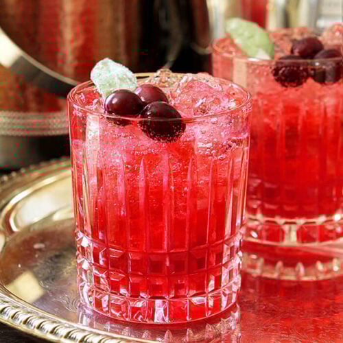 Cranberry Sage Cocktail with Cranberries and Sage Leaf Garnish