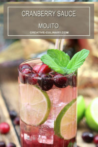 Cranberry Sauce Mojito Cocktails Garnished with Cranberries and Mint