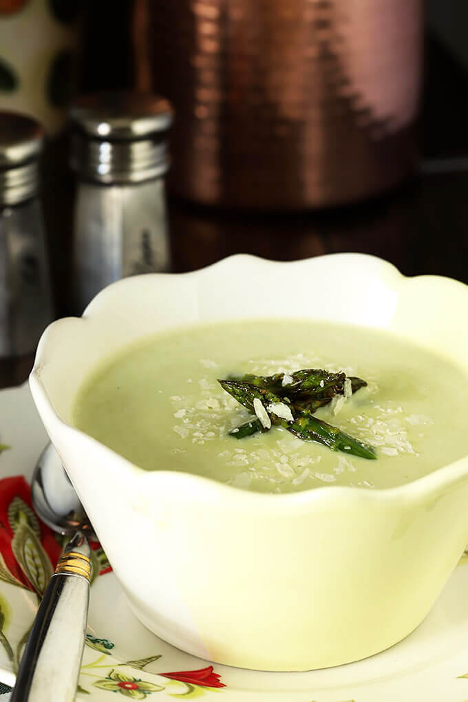 Cream of Roasted Asparagus Soup with Garlic & Parmesan in a White and Yellow Bowl