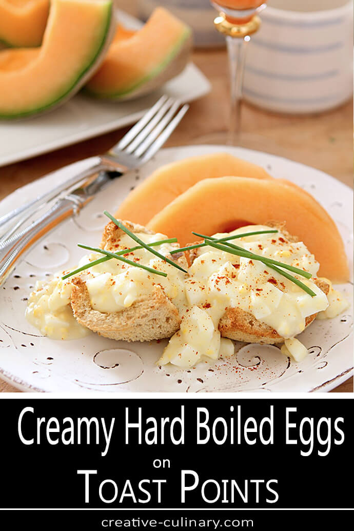 Creamy Hard Boiled Eggs on Toast Points Served with Cantelope and Garnished with Chives and Paprika