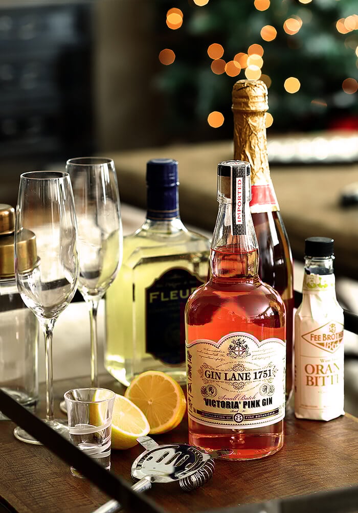 Ingredients for French 77 Pink Champagne Cocktails on Bar Cart