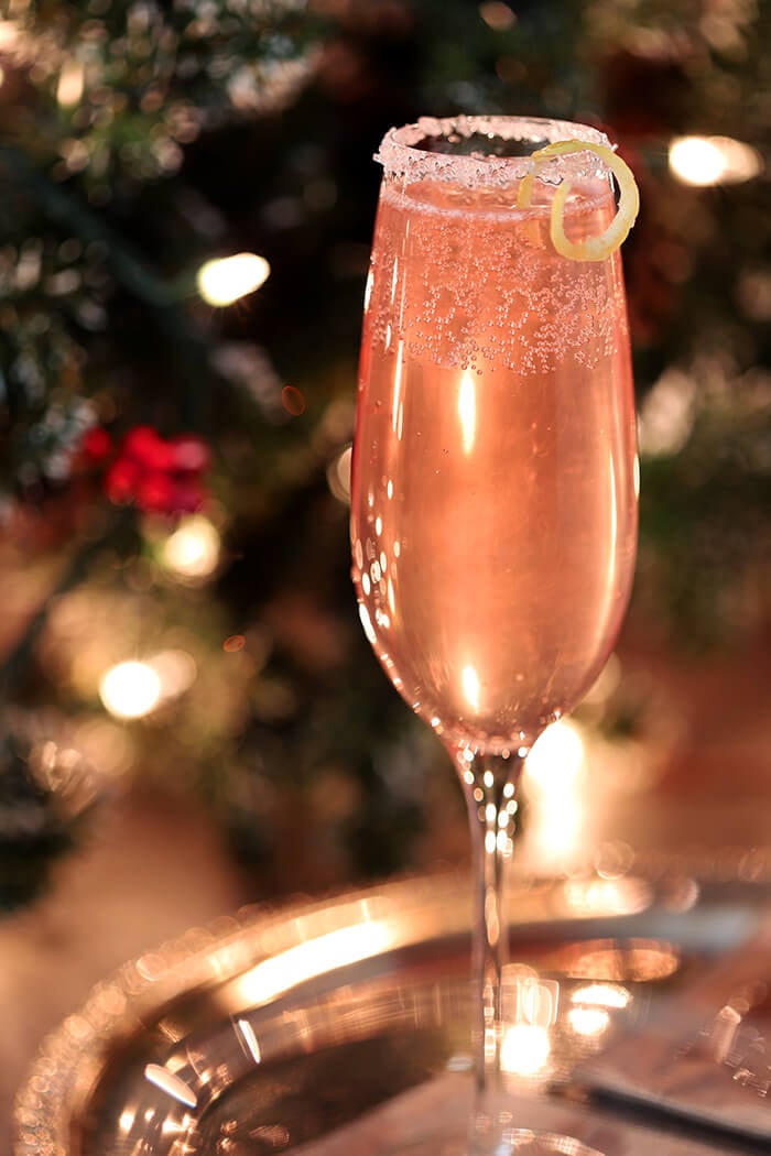French 77 Pink Champagne Cocktail Garnished with Lemon Peel