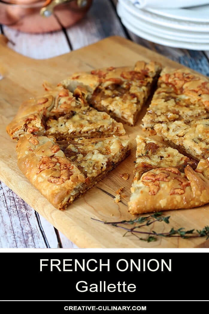 French Onion Galette Sliced, on a Bread Board