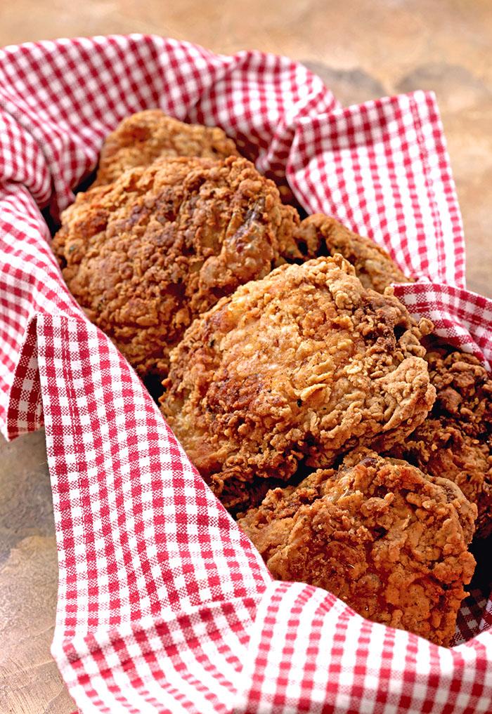Buttermilk Fried Chicken in a red and white check basket.