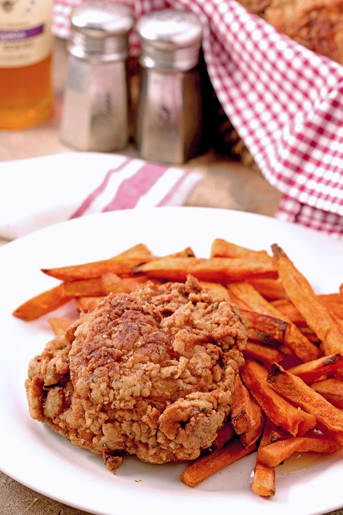 Buttermilk Fried Chicken served with oven baked sweet potato fries.