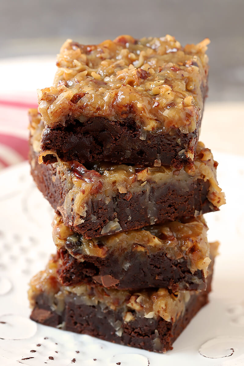 Stack of German Chocolate Brownies on a White Plate