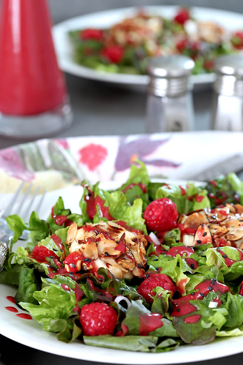 Goat Cheese and Raspberry Salad on a White Plate with Raspberry Dressing