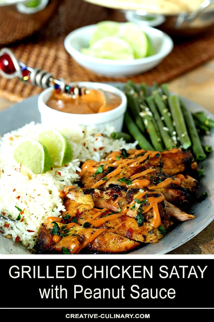 Grilled Chicken Satay with Peanut Sauce on Plate with Green Beans and Rice