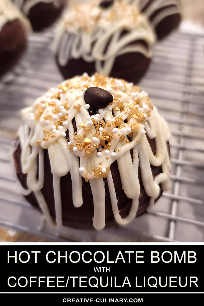 Boozy Hot Chocolate Bomb Decorated with Gold Sparkles, White Pearls, and a Single Coffee Bean