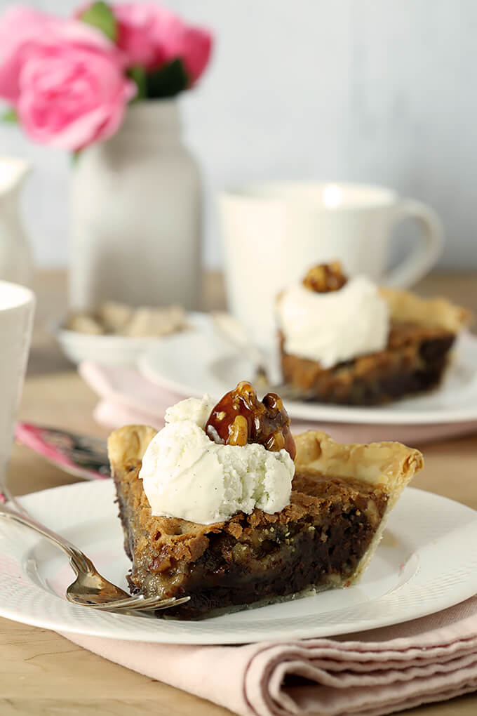 Kentucky Derby Pie with Walnuts and Bourbon Two Servings on a Table