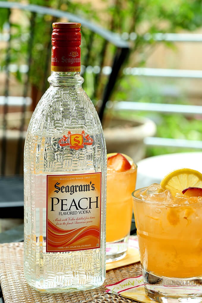 Kentucky Peach Bourbon and Vodka Cocktail and a Bottle of Seagram's Peach Vodka