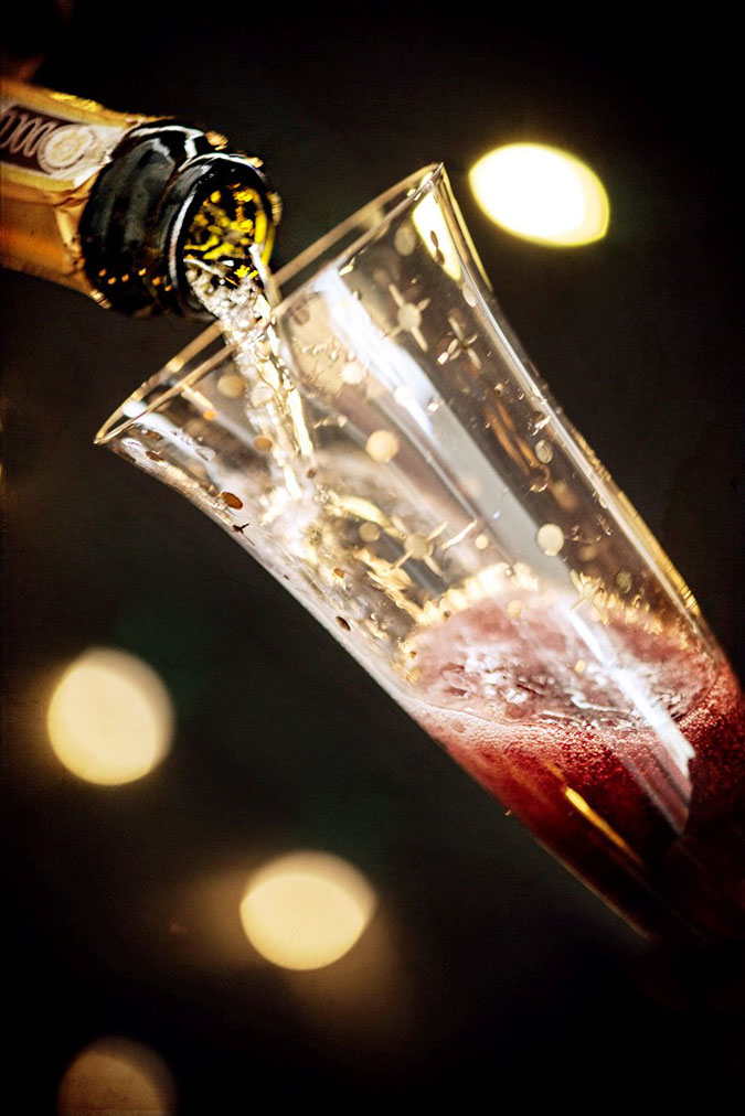 Kir Royale Champagne Cocktail Kir Royale Champagne Cocktail Showing Champagne Pouring into Glass with Creme de Cassis