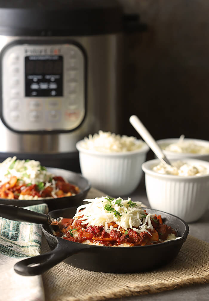 Quick Cheesy Lasagna in Instant Pot Shown with Appliance and Three Cheeses