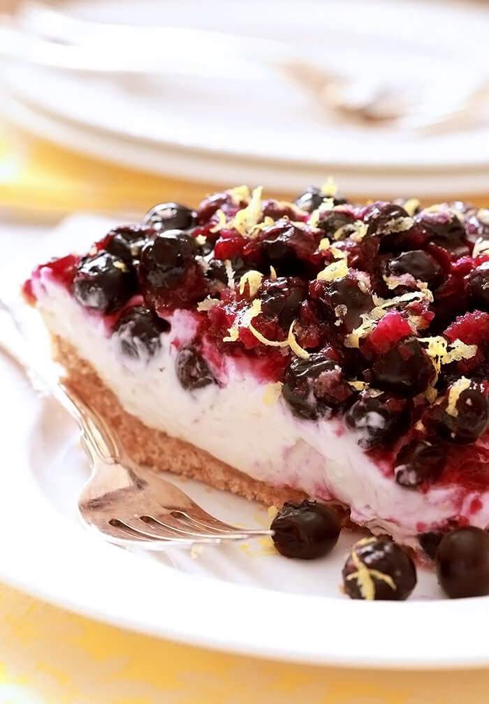 Lemon Cream Pie with Blueberries Slice on White Plate