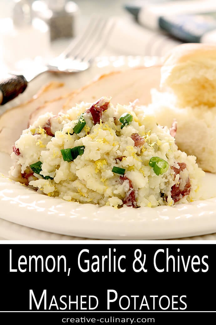 Lemon, Garlic, and Chives Mashed Potatoes Served on a Round White Plate