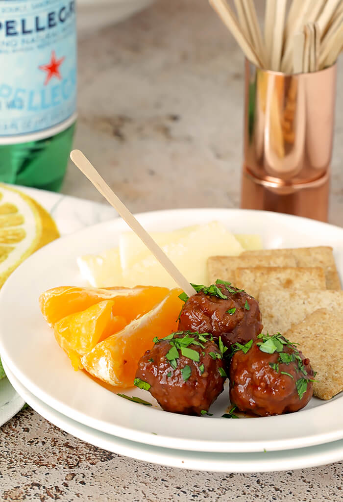 Appetizer Plate of Meatballs, Fruit, Crackers, and Cheese