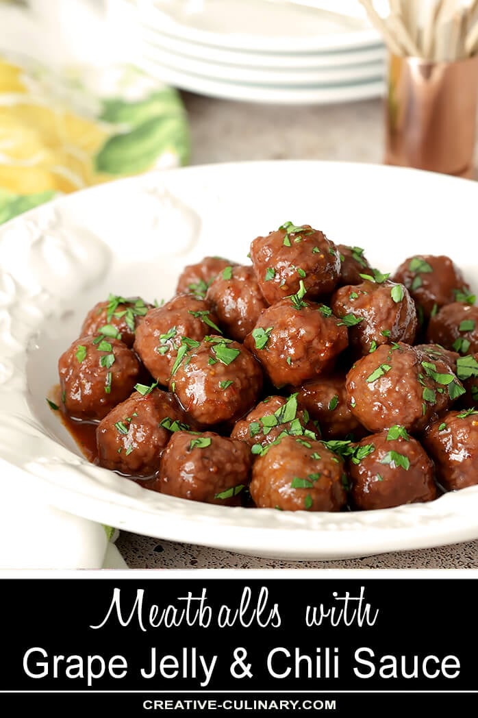 Grape Jelly and Chili Sauce Meatballs Served in a White Bowl with Parsley Garnish