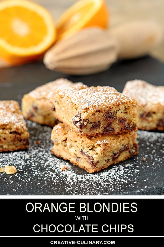 Chocolate Chip Blondies with Orange Zest Stacked and Dusted with Powdered Sugar