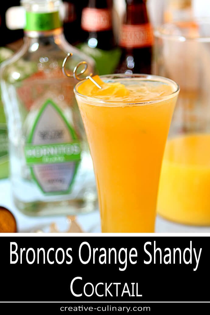 Orange Shandy Cocktail Served in a Tall Glass and Garnished with an Orange Slice