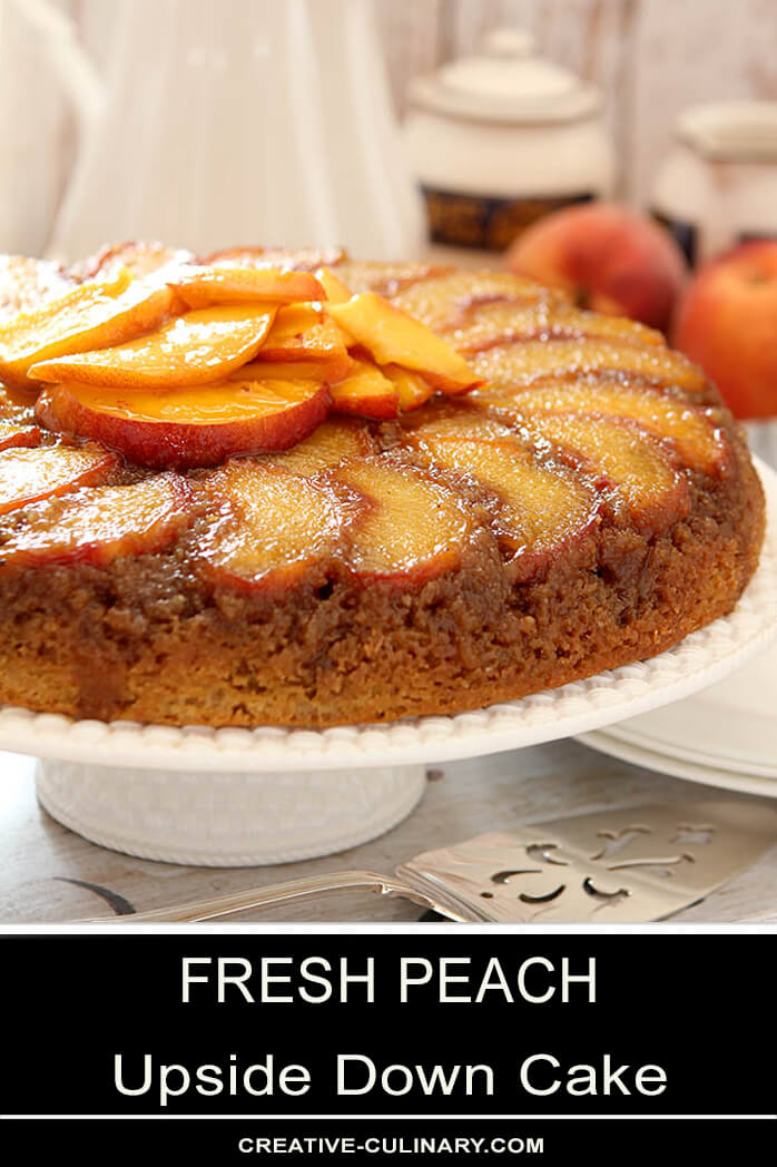 Peach Upside Down Cake on Cake Plate with Sliced Peaches on Top