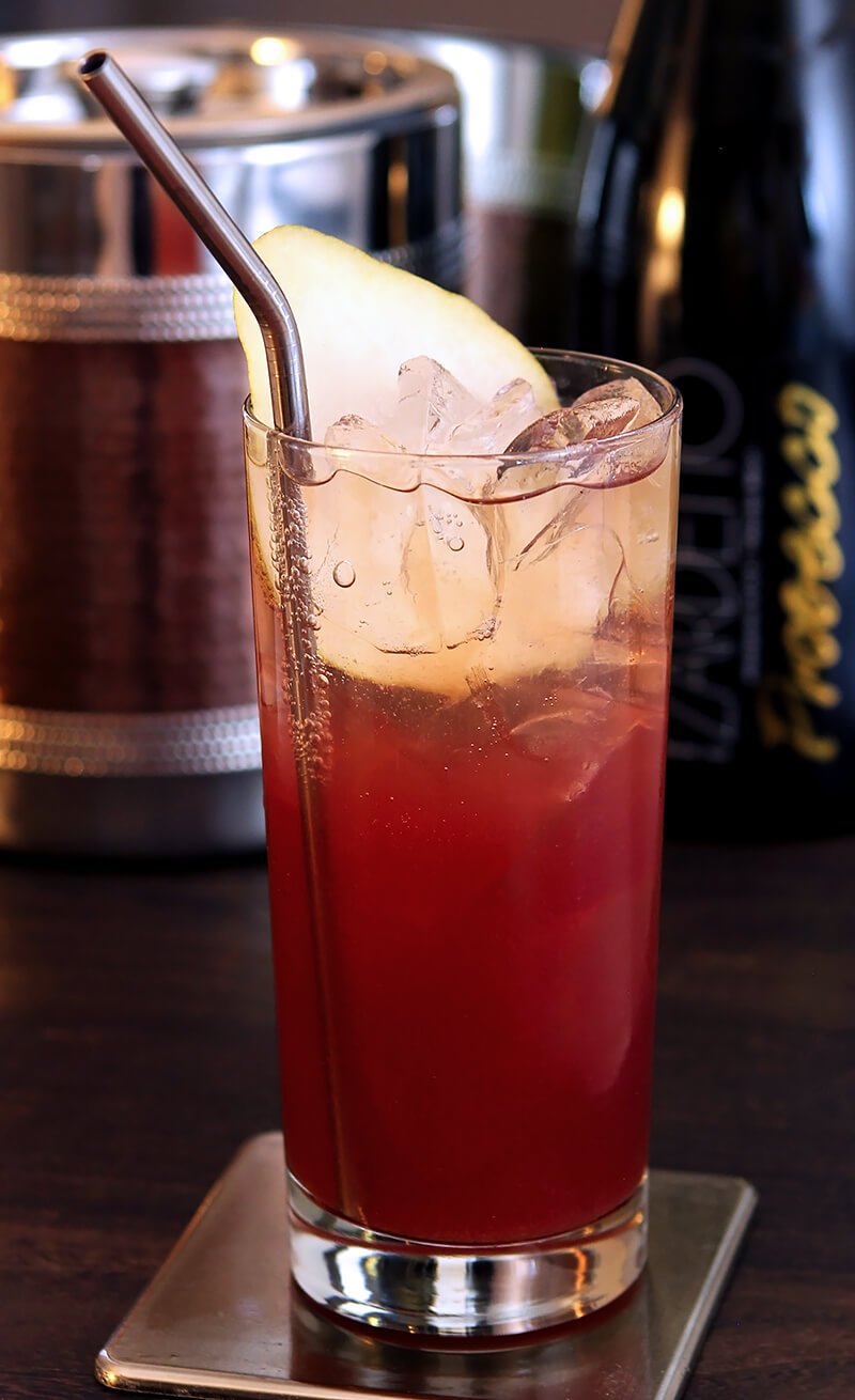 Pear, Pomegranate, and Prosecco Cooler in Tall Collins Glass with Pear Garnish