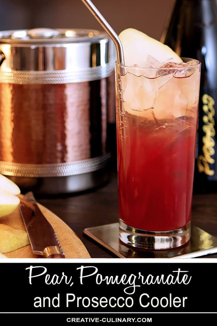 Pear Pomegranate and Prosecco Cooler in a Tall Glass with Pear Slice Garnish