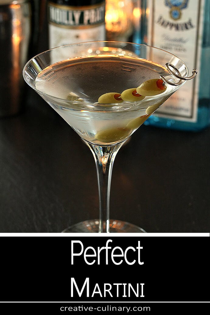 The Perfect Martini Served with Green Olives in a Martini Glass